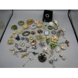 A large collection brooches