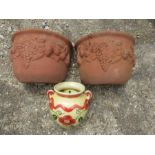 pair terracotta wall planters and one other