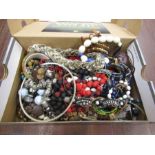A shoe box of costume jewellery