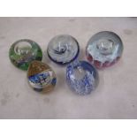 5 dump style paperweights