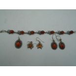 'Amber' jewellery to include 2 pairs of earring s and a pendant all stamped 925 and a white metal