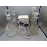 Four glass decanters and one glass dartington crystal jug