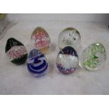 6 dump style paperweights