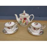 Pair of Royal Albert Celebration teacups and saucers and a Sadler teapot