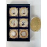 A boxed set of 6 gold plated medallions 'Queens speeches' and an oval 'three Kings' medallion.