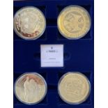 A set of 4 (70mm) 'Gold Giants' medallions in a wooden box