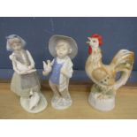 2 figurines and a chicken figure