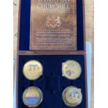 Winston Churchill - a set of 4 gold plated medaillions (70mm) in a wooden box, plus a cased set of 4