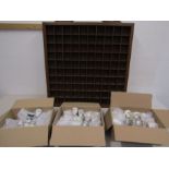 A collection of 100 egg cups with a wooden display 79x79cm not all egg cups photographed as