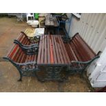 Garden table, bench and 2 chairs with heavy ornate wrought iron ends and wooden slats