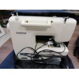 Brother electric sewing machine in carry bag with all attachments and booklet
