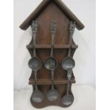 Dutch pewter spoons in display rack