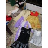 Various fancy dress outfits including pantomime cow and a quantity of shawl/scarfs in packaging