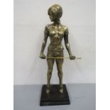After Bruno Zach, a brass sculpture of an erotic female dominatrix with cane, mounted on a black