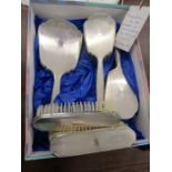 A silver backed vanity set