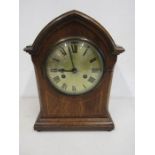 Edwardian mantle clock with pendulum and key.