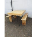 A rustic home made chunky pine table and benches