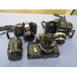 2 Nikon cameras and Ricoh camera with lens