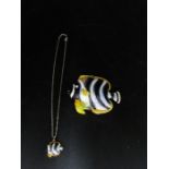 Enamel fish with smaller enamel fish pendant on chain inside