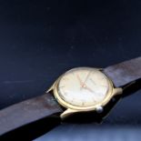 A vintage Helvetia gentleman's wristwatch. The golden dial with raised gilt batons denoting hours,