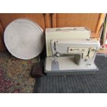 Vintage Singer electric sewing machine (plug removed for display purposes only) and reel of