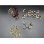 Angel pendants, pomander balls, tortoishell hair comb and belt buckles