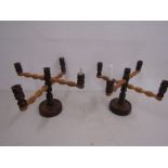 A pair of wooden candle holders