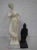 2 resin figures - a fisherman and Greek goddess