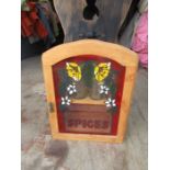 Spice cupboard with stained glass door and spice jars