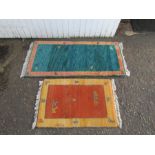 2 Wool rugs. Largest 70cm x 160cm approx