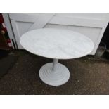 A round marble top table with steel base 100cm dia