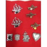 Nautical brooches, 3 others and heart shaped pewter dish