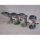 4 leaping dolphin figurines with lustre glaze