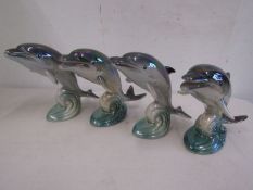 4 leaping dolphin figurines with lustre glaze