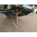 A green parasol in good condition