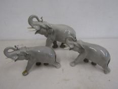 3 USSR elephants largest 23cmH one small one has had repairs-as pictured