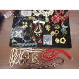 Collection of costume jewellery in tin