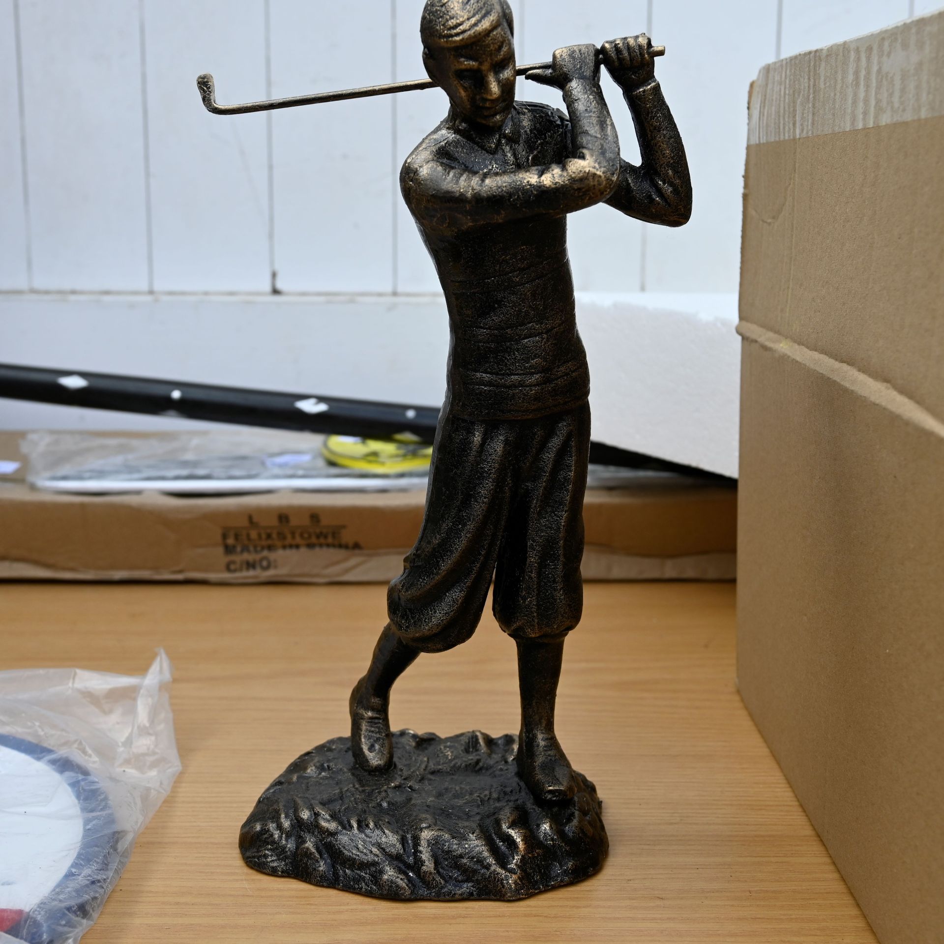 Bronze finish golfer figure