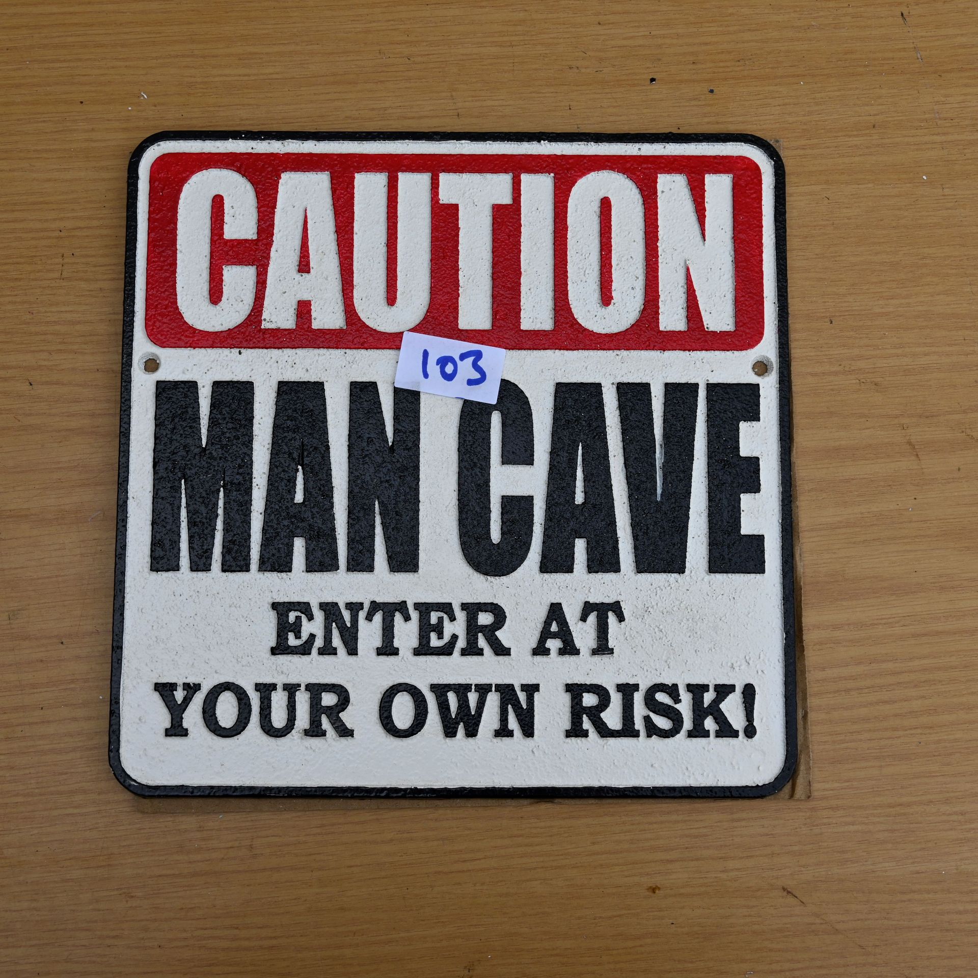 Caution Man cave sign