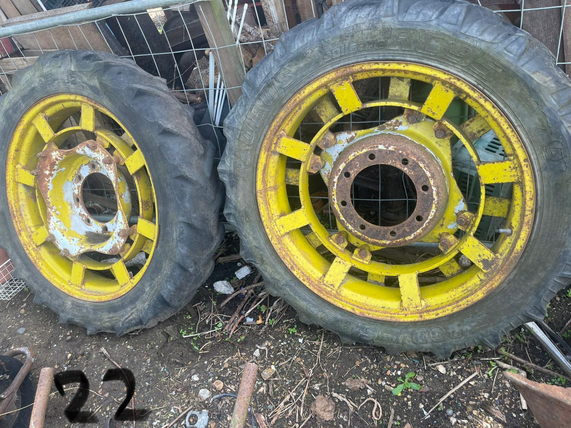 Pair of yellow tractor wheels