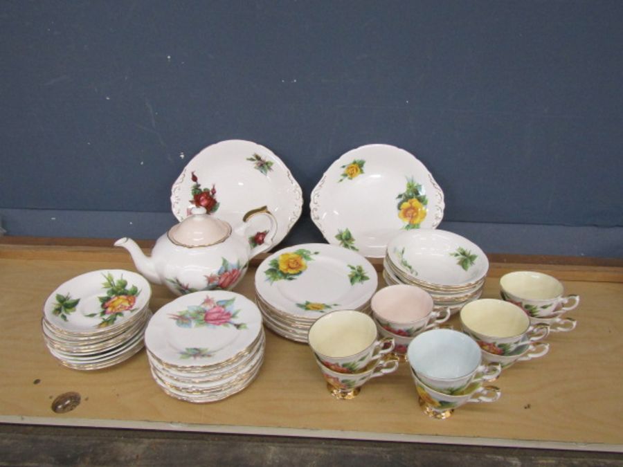 Paragon Wheatcroft part tea set comprised of teapot, 11 saucers, 9 cups, 13 tea plates, 8 desssert