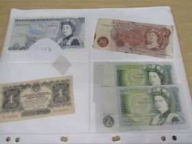 Paper money 2 x green 1 pound, brown 10 shillings, 1 x blue £5 and Russian note