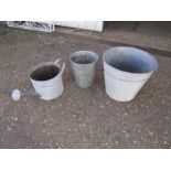 Metal garden pots and watering can