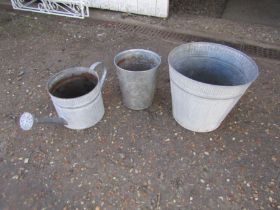 Metal garden pots and watering can