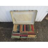 Vintage suitcase full of vintage books