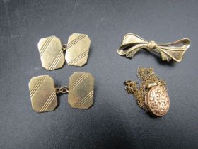 9ct gold cufflinks, bow brooch and locket, 6.95 gms gross weight