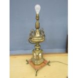 Ornate brass table lamp with marble base