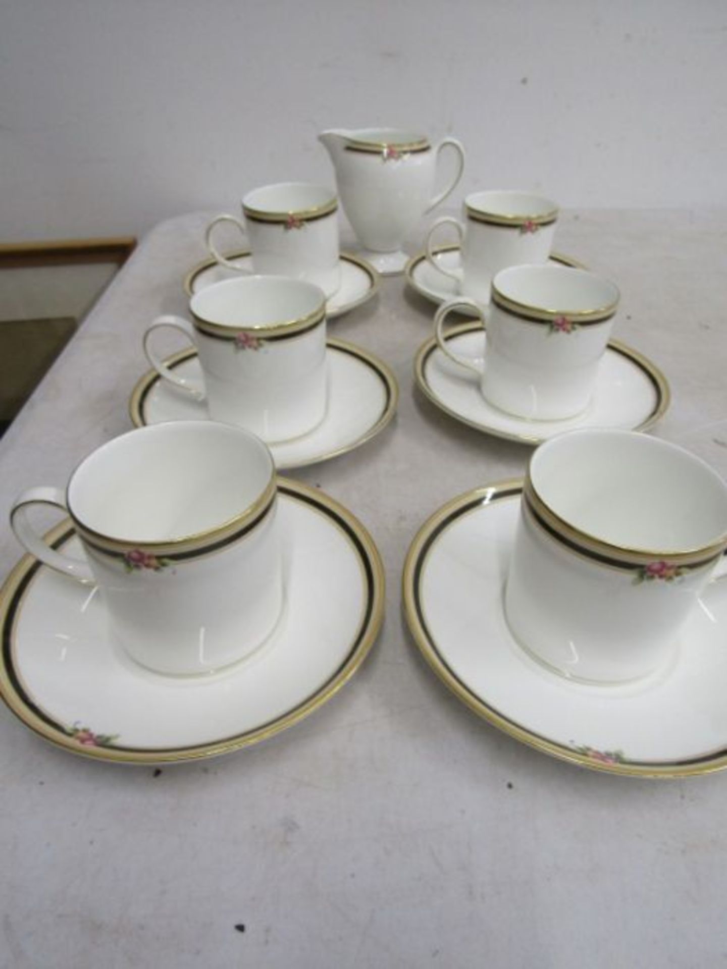 Wedgwood 'Clio' coffee set (part) 6 cans and saucers and a milk jug