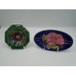 2 Moorcroft ashtrays - one green octagonal shape, approx 11cm wide and the other blue oval shaped,