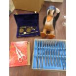 Pan scales, wooden penguin, grape scissors and boxed cutlery